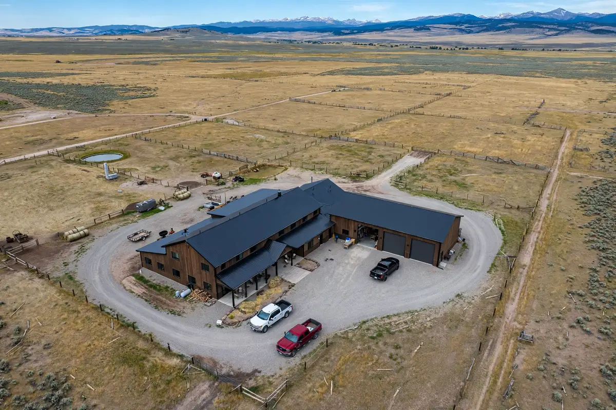 Aerial view of a Wyoming ranch property with a barndominium and shop building
